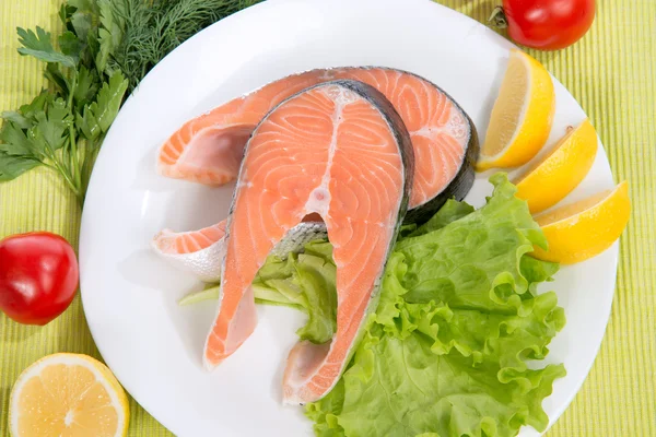 Raw salmon steak red fish on a plate — Stock Photo, Image