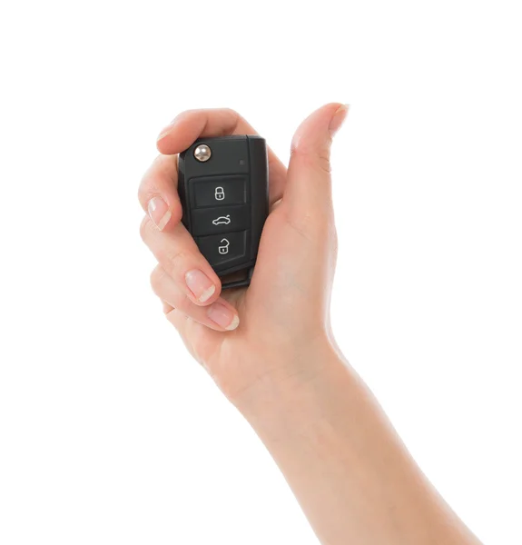 Hand with car key isolated