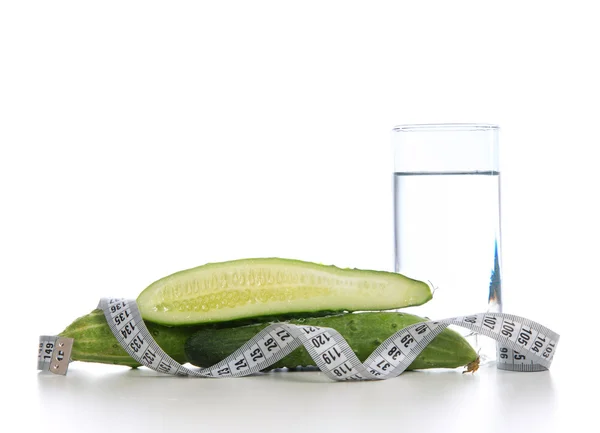 Weight loss concept with tape measure organic green cucumbers an — Stock Photo, Image