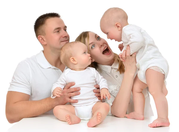 Family mother and father with newborn child baby kids playing  y — Stock Photo, Image