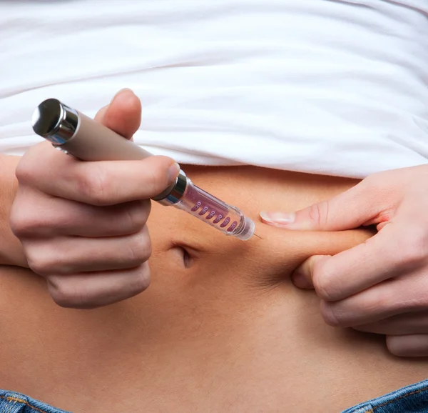 Doctor making diabetes patient insulin shot by syringe — Stock Photo, Image