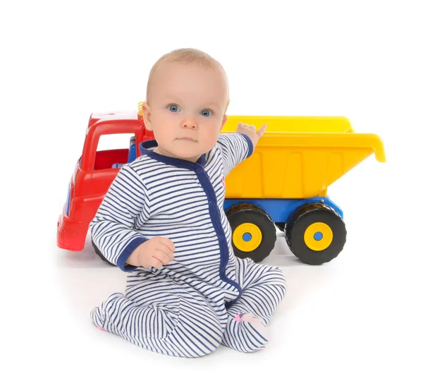 Child baby boy toddler happy sitting with big toy car truck — Stock Photo, Image