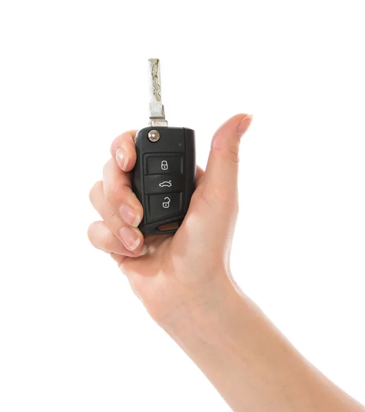 Hand met auto sleutel geïsoleerd — Stockfoto