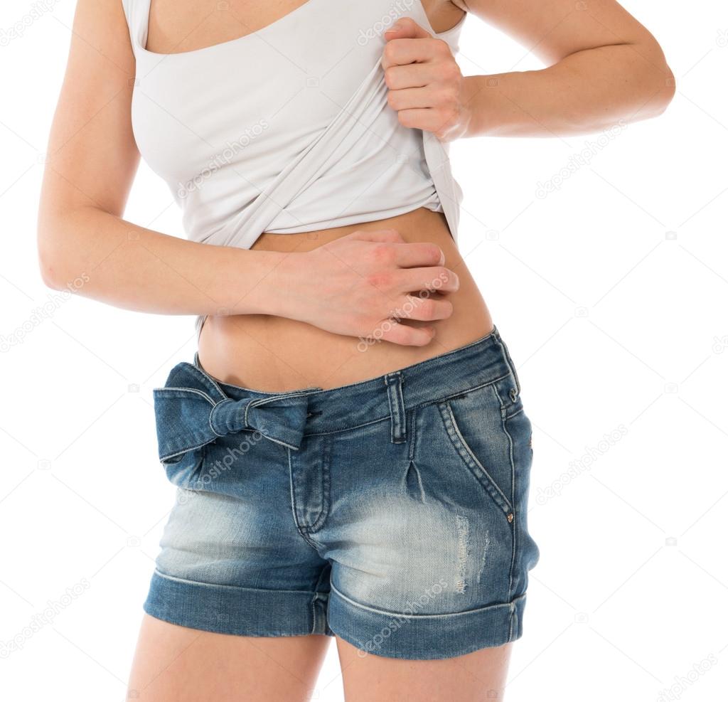Young woman allergy scratching her abdomen stomach 