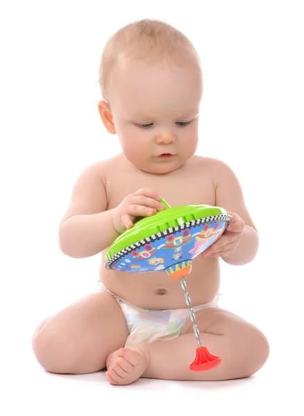 Niño bebé niño pequeño jugando con un juguete de remolino —  Fotos de Stock