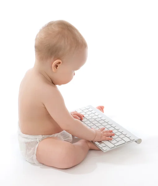 Infant child baby boy toddler typing computer keyboard — Stock Photo, Image
