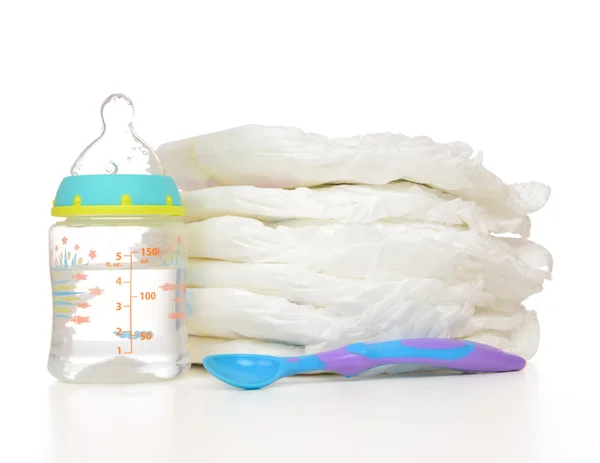 New born baby child stack of diapers spoon — Stock Photo, Image