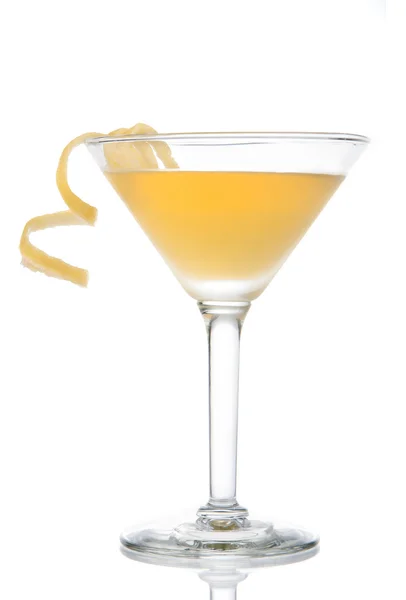 Yellow banana cocktail in martini glass with lemon twist — Stock Photo, Image