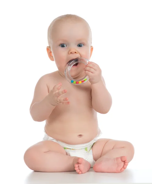 Infant child baby boy toddler playing and eating with circle rin — Stock Photo, Image