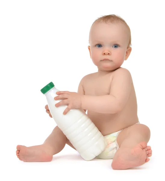 New born infant child baby girl toddler sitting bottle with milk — Stock Photo, Image