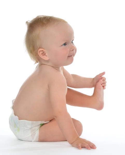 Infant child baby toddler sitting and holding leg happy — Stock Photo, Image