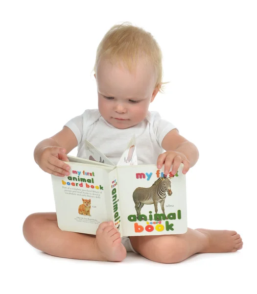 Infant child baby girl toddler sitting and reading book — Stock Photo, Image