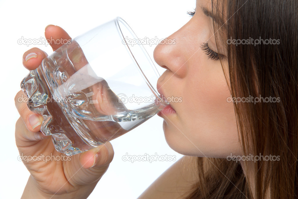 Woman drinking water from glass