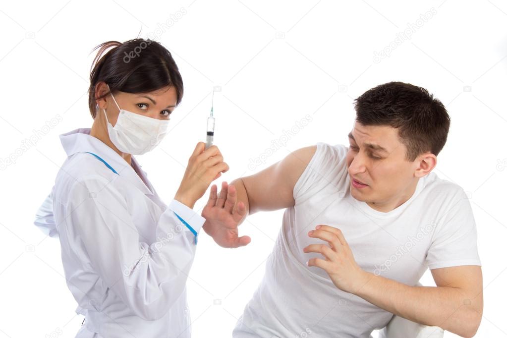 Nurse syringe needle and man scary of injection vaccination phob