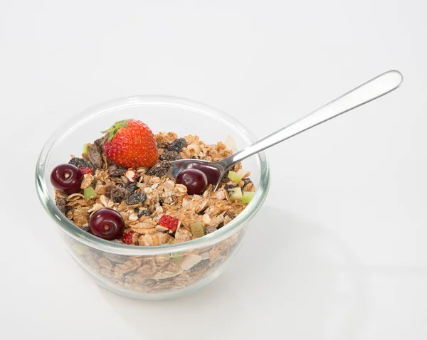 Muesli granen kom en lepel met walnoot, amandel, pijnboompitten — Stockfoto