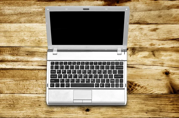 Laptop on wood background — Stock Photo, Image