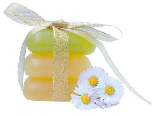 Soap with golden ribbon and flowers isolated on white background — Stock Photo, Image