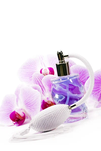Dla kobiet perfumy i orchidea kwiat. — Zdjęcie stockowe