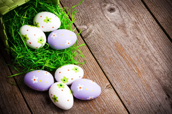 Easter eggs painted on the wooden background. — Stock Photo, Image