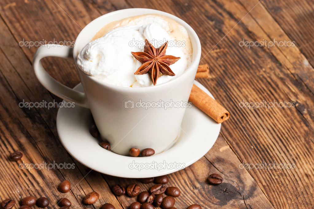 Delicious cup of coffee in a rustic background.
