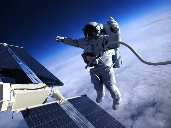 Космонавт в космосе вокруг солнечных батарей — стоковое фото