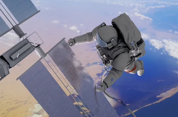 우주 비행사가 지구 위의 우주에서 일하고 있습니다. — 스톡 사진