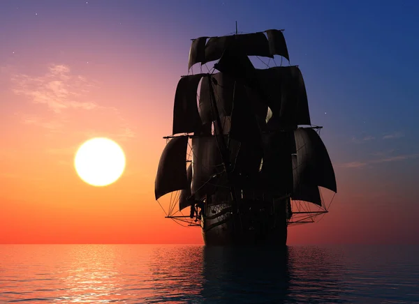 日落时在海里的老式帆船 — 图库照片