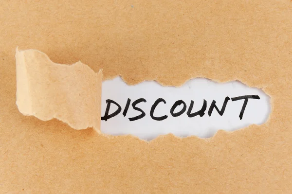 Teared paper with discount word — Stock Photo, Image