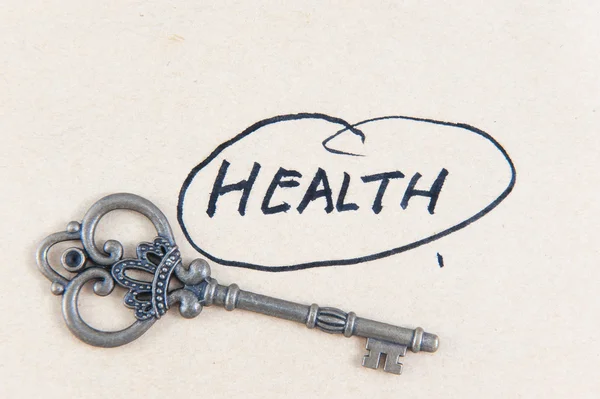 Old key and health word — Stock Photo, Image