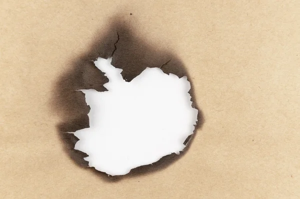 Verbrande gat van papier — Stockfoto