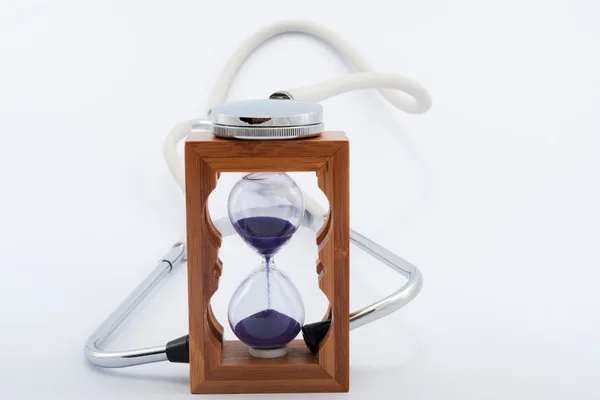 Stethoscope and hourglass — Stock Photo, Image