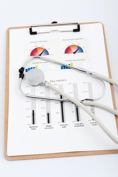 Business graph with stethoscope — Stock Photo, Image