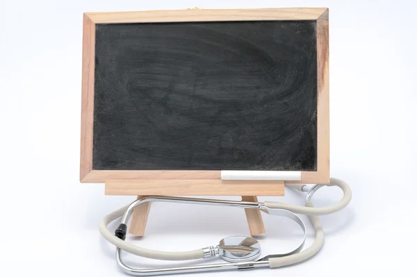 Stethoscope and blackboard — Stock Photo, Image