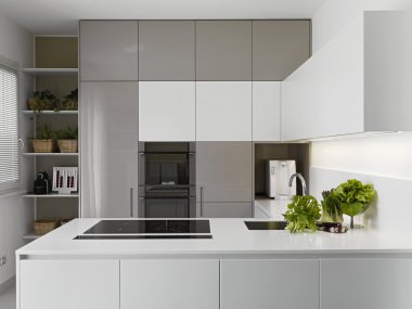 Modern kitchen with vgetables on the white worktop clipart