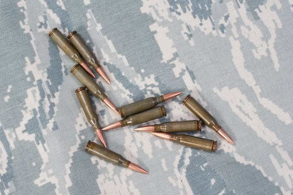 Ammo on camouflage background — Stock Photo, Image