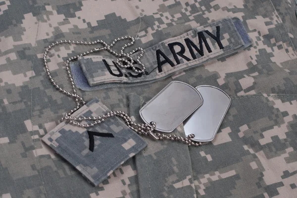Us army camouflaged uniform with blank dog tags — Stock Photo, Image