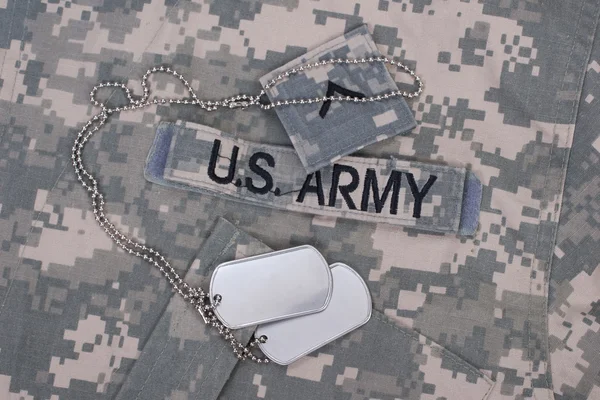 Us army camouflaged uniform with blank dog tags — Stock Photo, Image