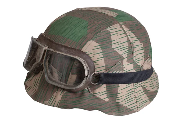 Camouflaged nazi german helmet with protective goggles — Stock Photo, Image