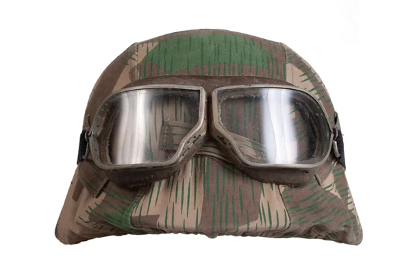 Camouflaged nazi german helmet with protective goggles — Stock Photo, Image