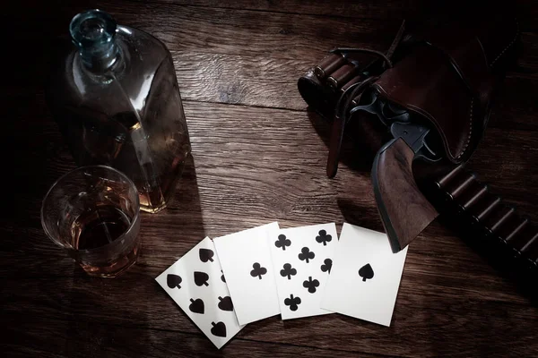 Wild west gambling. Dead man's hand. Two-pair poker hand consisting of the black aces and black eights, held by Old West folk hero, lawman, and gunfighter Wild Bill Hickok when he was murdered while playing a game.