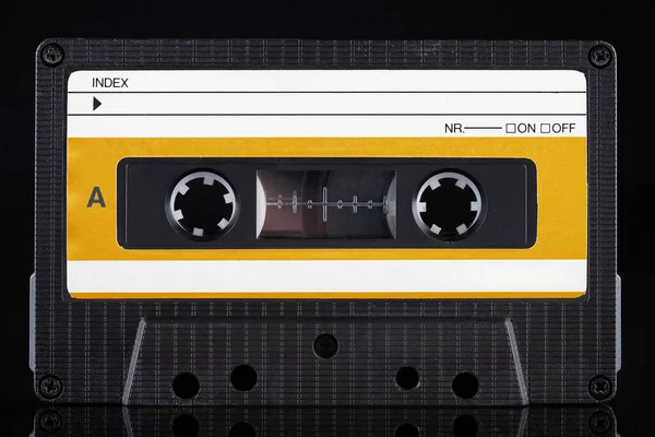 Yellow Labeled Retro Vintage Compact Cassette Side Black Background — 스톡 사진