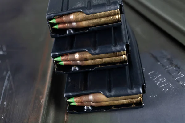 5.56x45mm NATO SS109/M855 cartridges with standard 62 gr. lead core bullets with steel penetrator on green ammo box