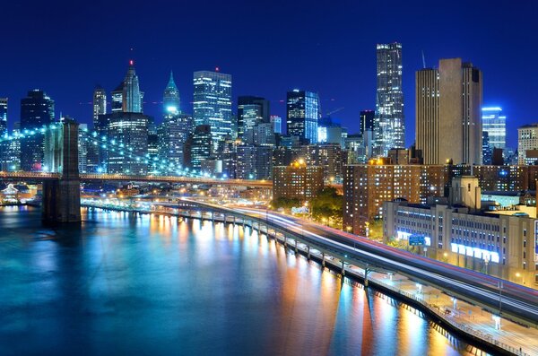 View of the financial district of Manhattan at night in New York City.
