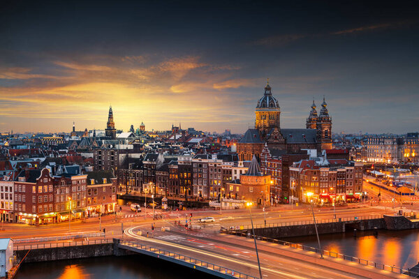Amsterdam, Netherlands town cityscape over the Old Centre District with Basilica of Saint Nicholas.