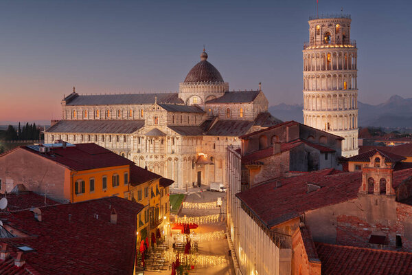 Pisa, Italy with the Duomo and Leaning Tower at dusk.