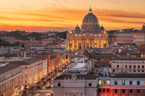 Vatican City skyline with St. Peter's Basilica during sunset.