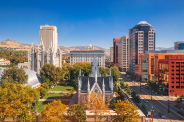Salt Lake City, Utah, USA downtown cityscape over Temple Square with autumn foliage. clipart