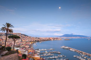 Naples, Italy aerial skyline on the bay with Mt. Vesuvius at dusk. clipart