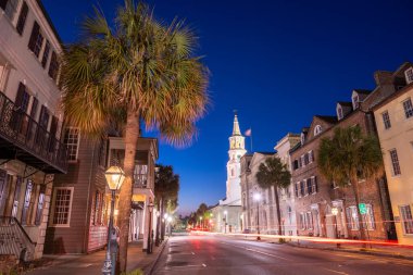Charleston, South Carolina, USA cityscape in the historic French Quarter at night.