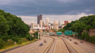 Pittsburgh, Pennsylvania, USA downtown city skyline over looking highways in the afternoon.